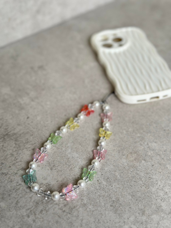 محافظ آیفون با بافت موجی سهبعدی و آویز فانتزی